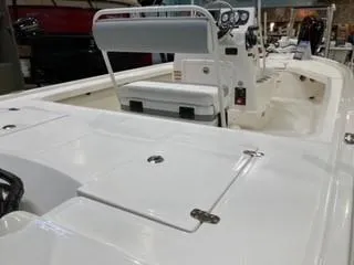 Slide: The Image of 2025 Mako 18 LTS boat interior with white seating and control panel. - 5