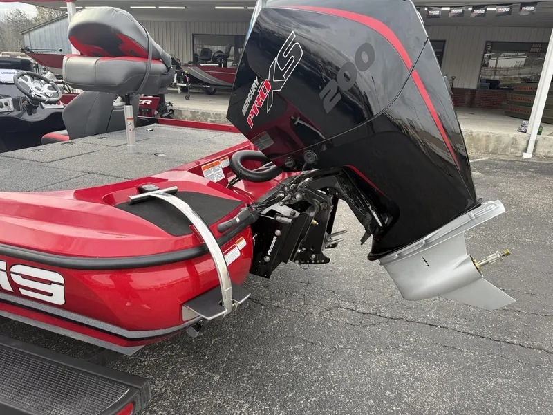 Slide: The Image of 2025 Nitro Z19 boat with powerful outboard motor, parked on pavement. - 3