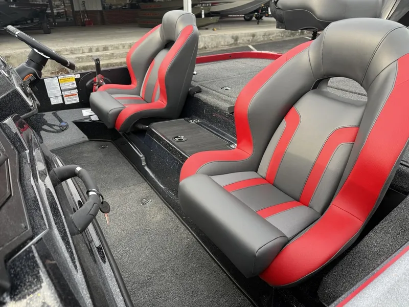 Slide: The Image of 2025 Nitro Z19 boat interior with red and gray seats, showcasing modern design. - 6