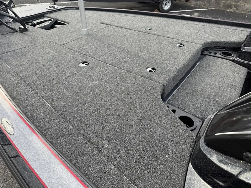 Slide: The Image of 2025 Nitro Z19 boat deck with gray carpet and storage compartments. - 7