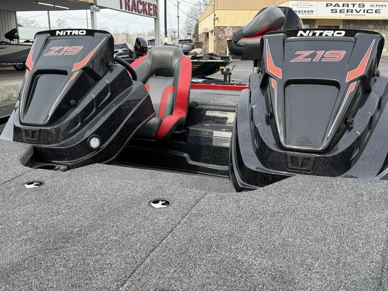 Slide: The Image of 2025 Nitro Z19 boat with dual seats and sleek design in a dealership setting. - 8