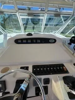 Slide: The Image of 2008 Grady-White Express 360 helm with control panel and steering wheel. - 22