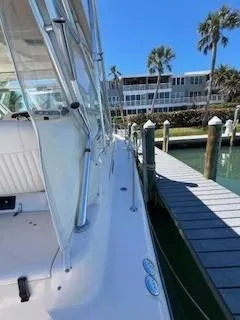 Slide: The Image of 2008 Grady-White Express 360 docked near waterfront buildings and palm trees. - 25