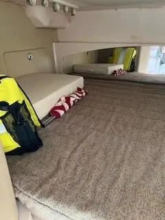 Slide: The Image of Interior cabin of 2008 Grady-White Express 360 with bed and life jacket. - 28