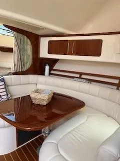 Slide: The Image of 2008 Grady-White Express 360 interior with elegant seating and wooden table. - 33