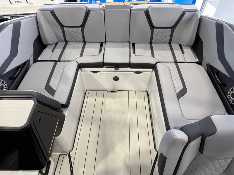 Slide: The Image of 2025 Yamaha Boats 255XD interior with gray seating and modern design. - 3