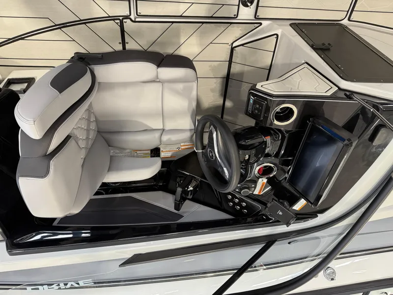 Slide: The Image of 2025 Yamaha Boats 255XD cockpit with modern steering and controls. - 4