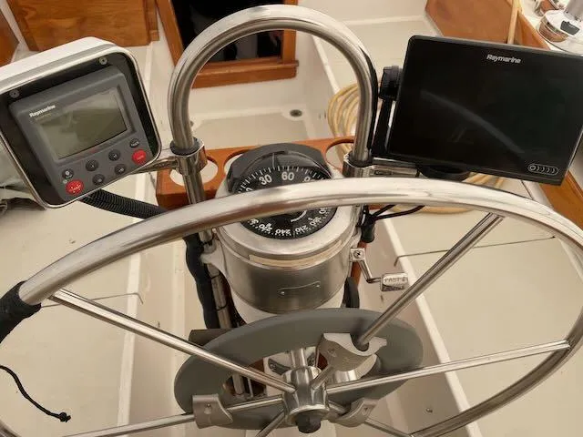 Slide: The Image of 1981 Bristol 40 Sloop helm with compass and navigation instruments. - 30