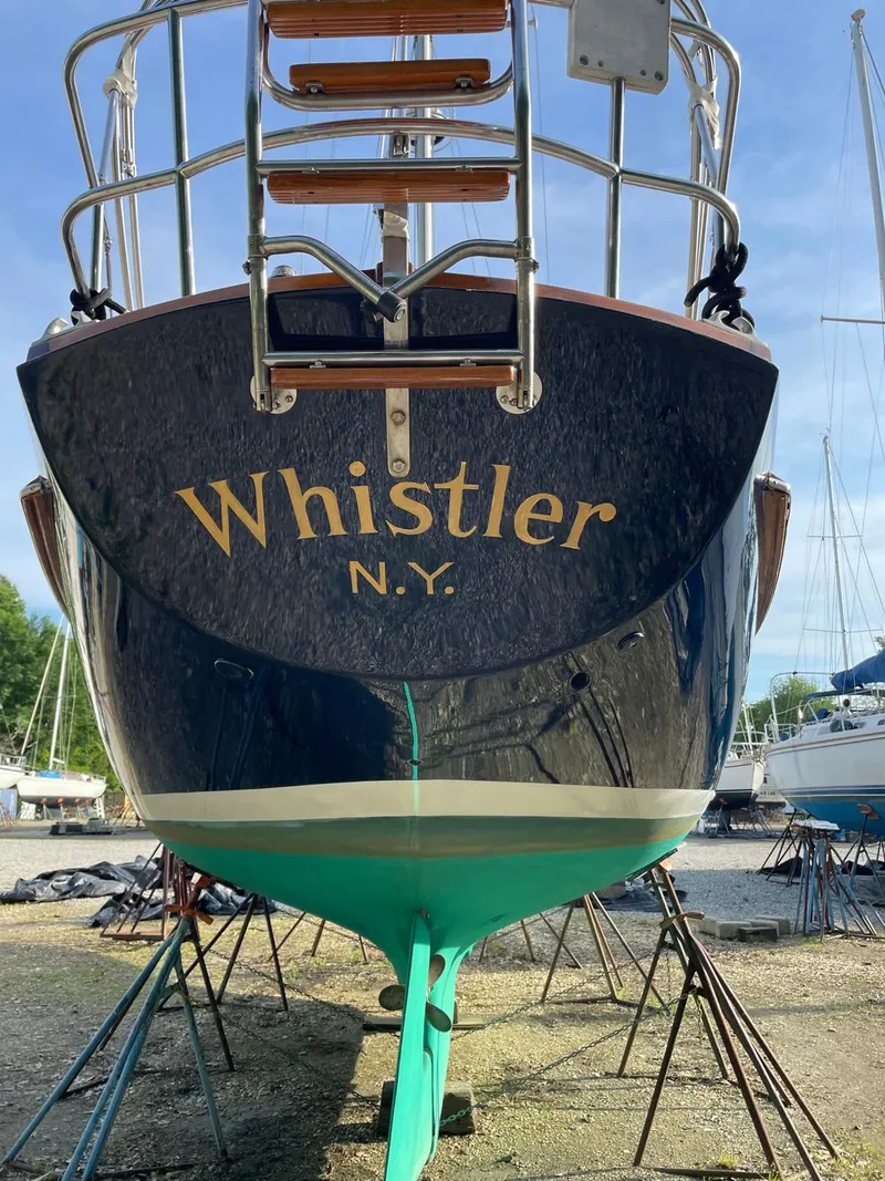 Slide: The Image of 1981 Bristol 40 Sloop "Whistler" in dry dock, showcasing elegant design and craftsmanship. - 34