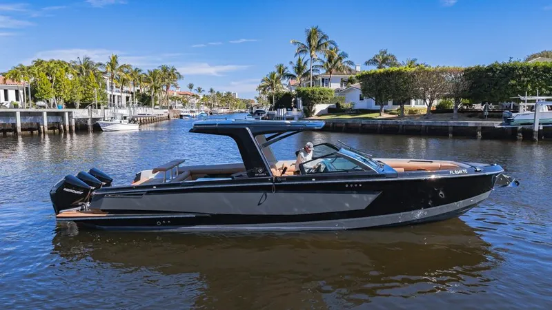 The Image of 2022 Aviara AV36 OB luxury boat cruising on a scenic waterway. - 0