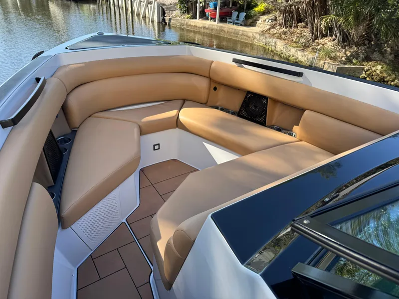 Slide: The Image of 2022 Aviara AV36 OB boat with tan leather seating in a spacious deck area. - 12