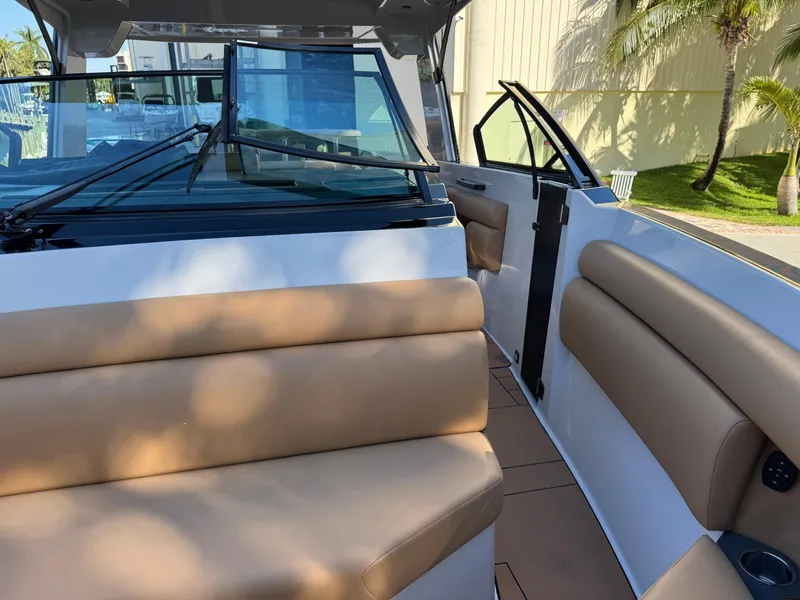 Slide: The Image of 2022 Aviara AV36 OB boat interior with tan seating and open door. - 13