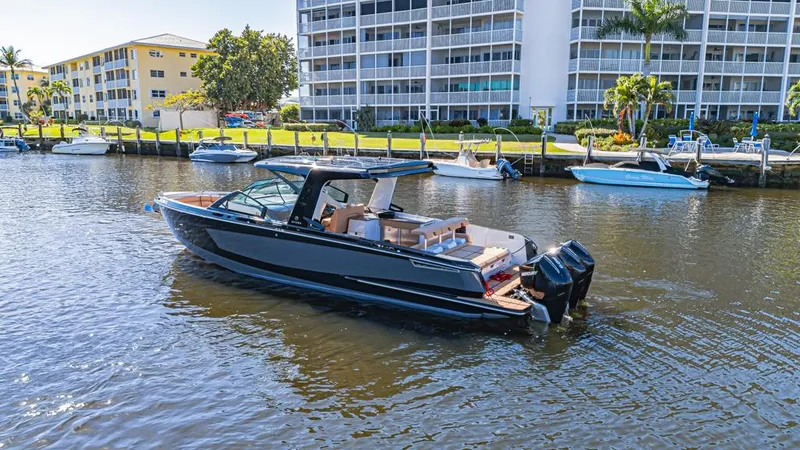 Slide: The Image of 2022 Aviara AV36 OB boat docked near waterfront buildings. - 2