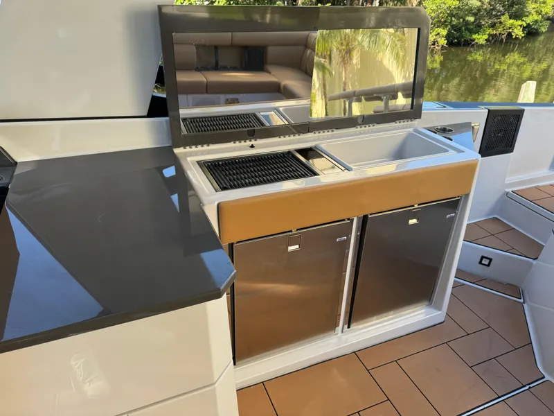 Slide: The Image of Outdoor kitchen on 2022 Aviara AV36 OB boat with grill and dual refrigerators. - 20
