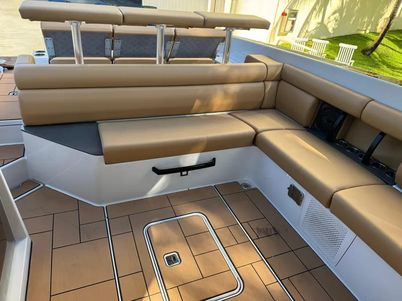 Slide: The Image of 2022 Aviara AV36 OB boat interior with tan seating and teak flooring. - 23