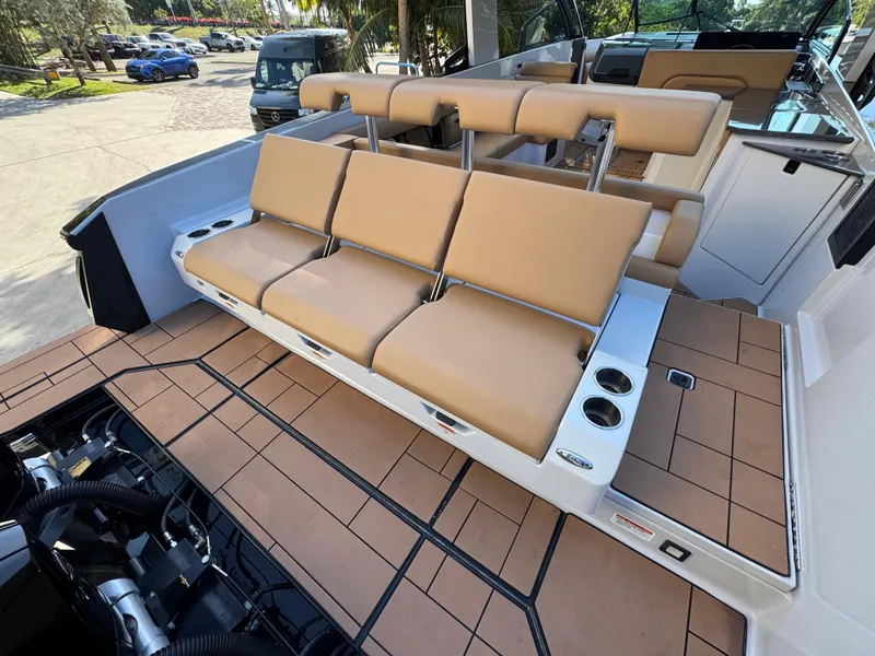 Slide: The Image of 2022 Aviara AV36 OB boat with tan seating and spacious deck layout. - 26