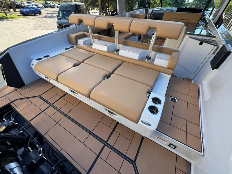 Slide: The Image of 2022 Aviara AV36 OB boat with tan seating and spacious deck layout. - 27