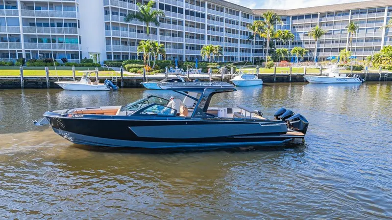 Slide: The Image of 2022 Aviara AV36 OB boat on water near waterfront buildings. - 3