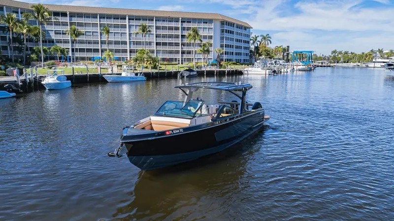 Slide: The Image of 2022 Aviara AV36 OB boat cruising in a scenic waterfront setting. - 4