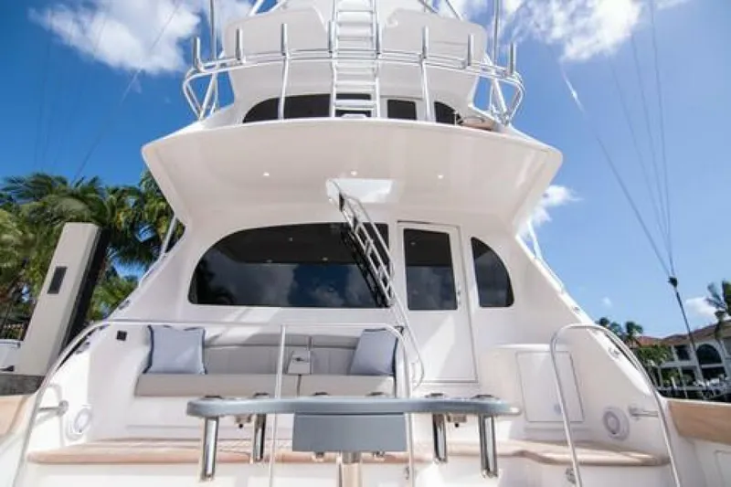 Slide: The Image of 2024 Viking 68 Enclosed Bridge yacht with luxurious seating and sleek design. - 29