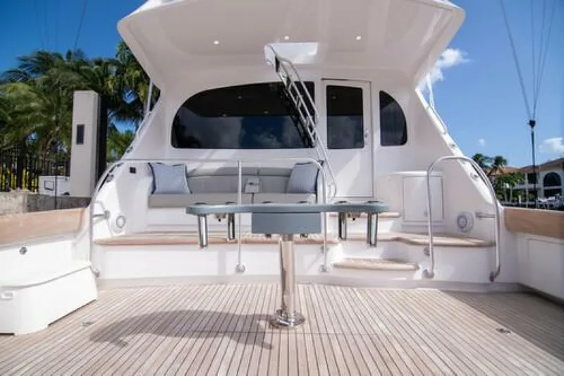 Slide: The Image of 2024 Viking 68 Enclosed Bridge yacht with spacious deck and seating area. - 5