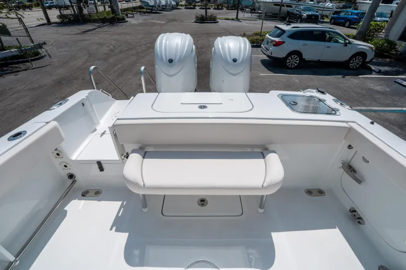 Slide: The Image of 2025 Sea Hunt Gamefish 25 boat interior with seating and dual engines. - 13