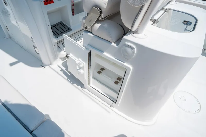 Slide: The Image of 2025 Sea Hunt Gamefish 25 boat interior with storage compartments and seating. - 17