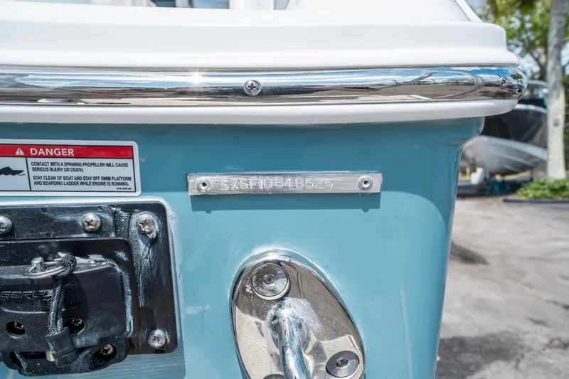 Slide: The Image of 2025 Sea Hunt Gamefish 25 boat stern with warning label and serial number. - 34