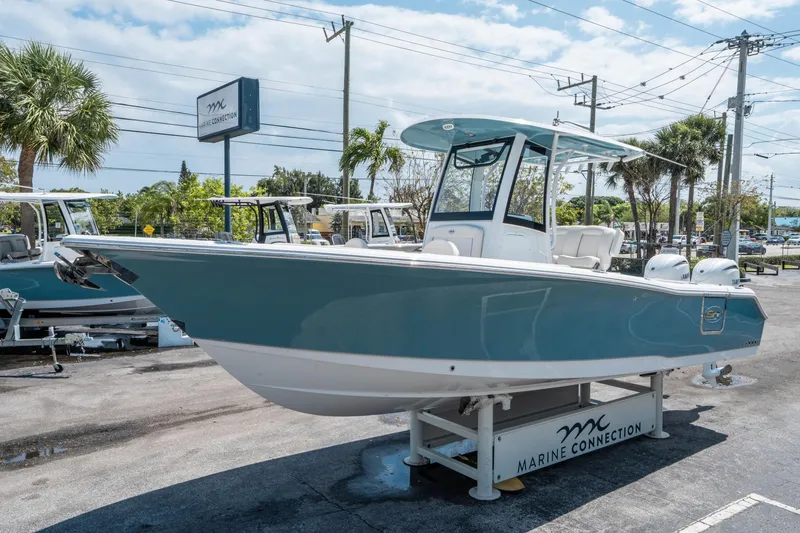 Slide: The Image of 2025 Sea Hunt Gamefish 25 boat displayed at Marine Connection dealership. - 6