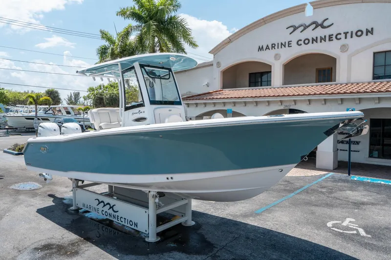 Slide: The Image of 2025 Sea Hunt Gamefish 25 boat displayed at Marine Connection dealership. - 8