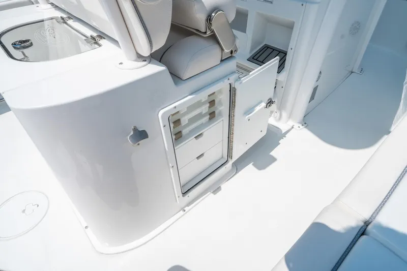 Slide: The Image of 2025 Sea Hunt Gamefish 25 boat interior with storage compartments and seating. - 18