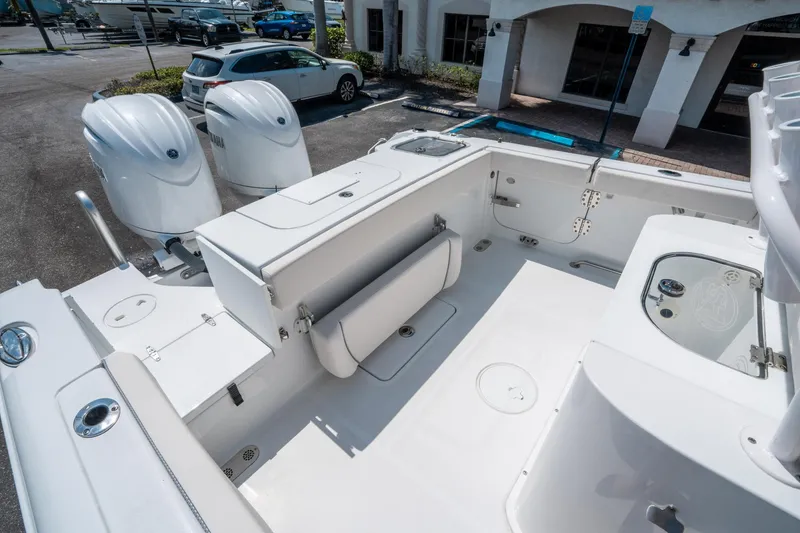 Slide: The Image of 2025 Sea Hunt Gamefish 25 boat interior with dual engines, spacious deck, and seating. - 11