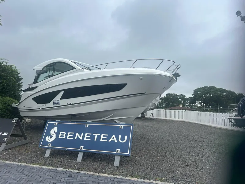 The Image of 2026 Beneteau 32 Gran Turismo yacht displayed outdoors with signage. - 0