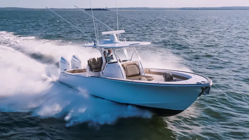 Slide: The Image of 2025 Valhalla Boatworks V-33 cruising swiftly on open water. - 1