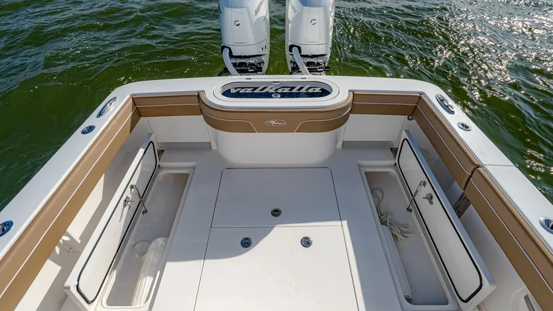 Slide: The Image of 2025 Valhalla Boatworks V-33 deck with twin engines on water. - 10