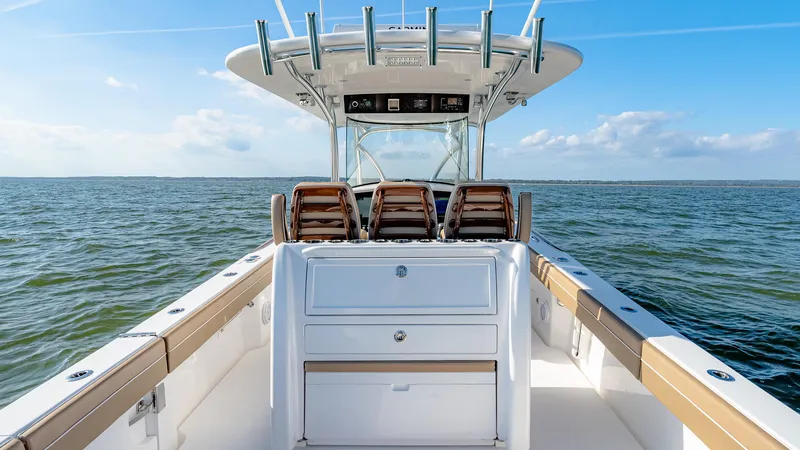 Slide: The Image of 2025 Valhalla Boatworks V-33 on open water, showcasing sleek design and spacious deck. - 20