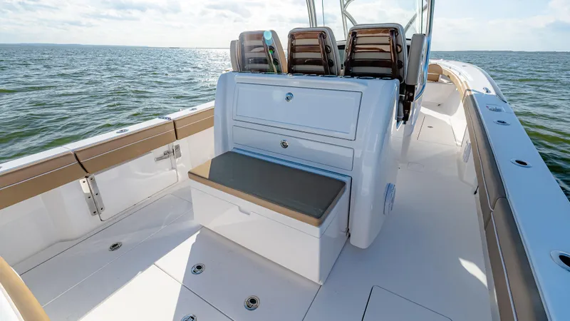 Slide: The Image of 2025 Valhalla Boatworks V-33 on open water, featuring sleek seating and storage. - 21