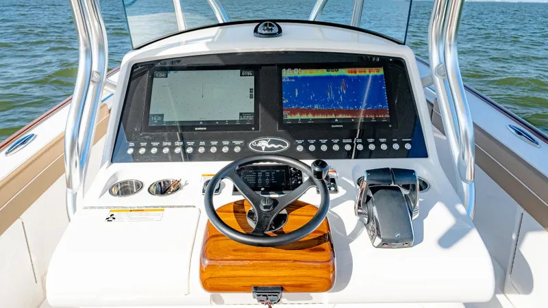 Slide: The Image of 2025 Valhalla Boatworks V-33 helm with advanced navigation displays and controls. - 27