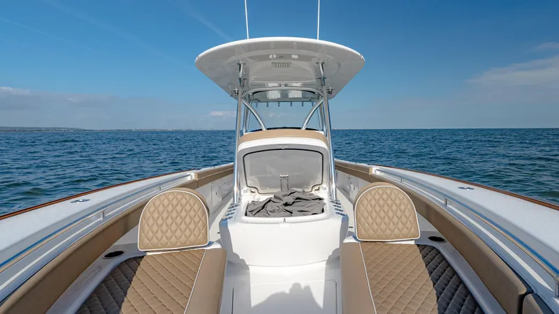 Slide: The Image of 2025 Valhalla Boatworks V-33 on open water, showcasing sleek design and luxury seating. - 32