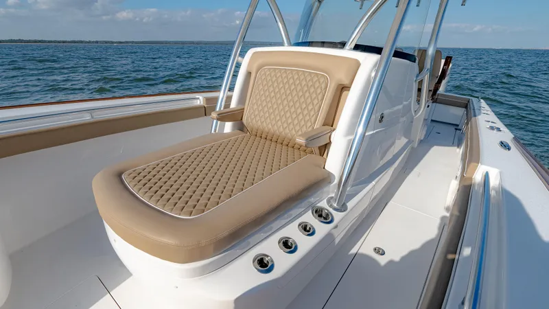 Slide: The Image of 2025 Valhalla Boatworks V-33 with luxurious seating on open water. - 33