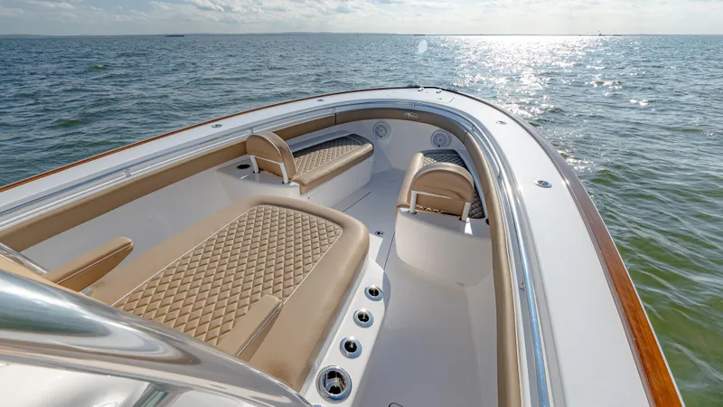 Slide: The Image of 2025 Valhalla Boatworks V-33 on open water, featuring luxurious seating and sleek design. - 35