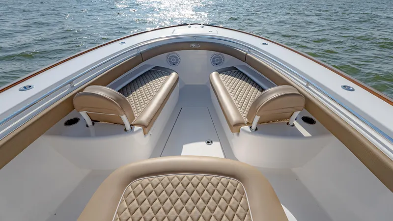 Slide: The Image of 2025 Valhalla Boatworks V-33 interior with luxurious seating on calm water. - 36