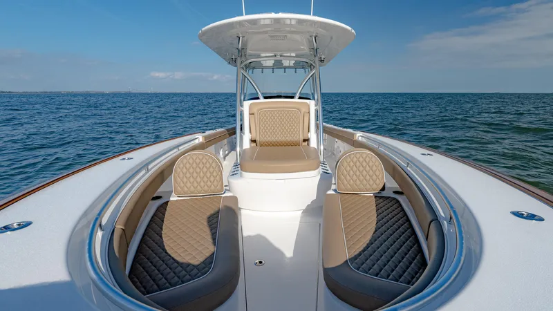 Slide: The Image of 2025 Valhalla Boatworks V-33 on open water, featuring luxurious seating and sleek design. - 38