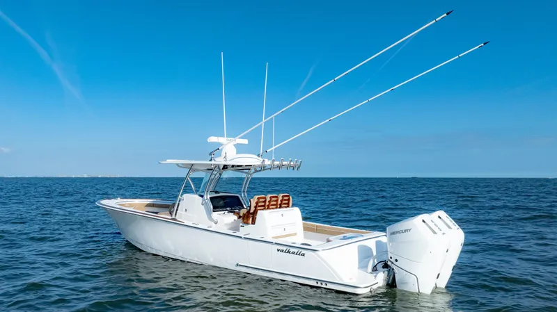 Slide: The Image of 2025 Valhalla Boatworks V-33 on open water, featuring dual outboard engines. - 4
