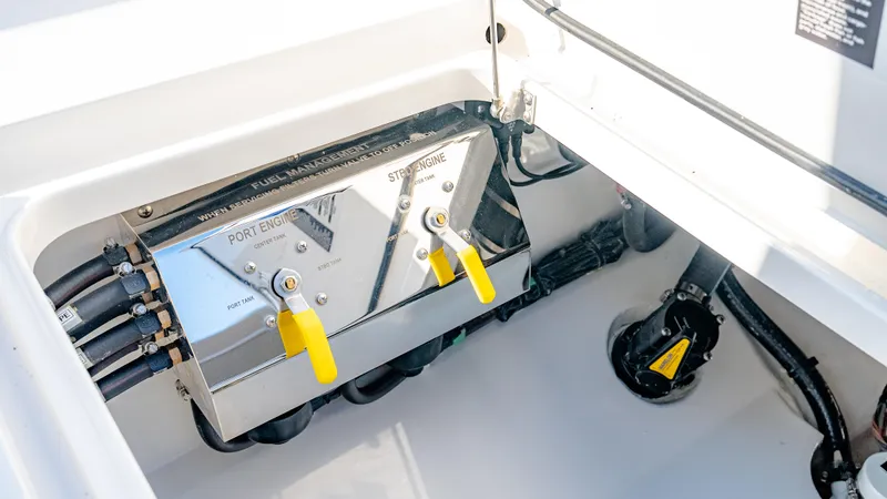 Slide: The Image of 2025 Valhalla Boatworks V-33 engine compartment with control panel and yellow levers. - 42