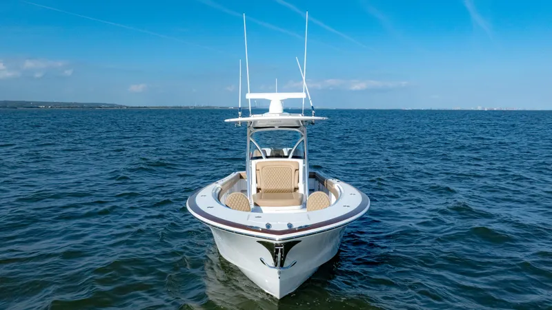 Slide: The Image of 2025 Valhalla Boatworks V-33 on open water under clear blue sky. - 7