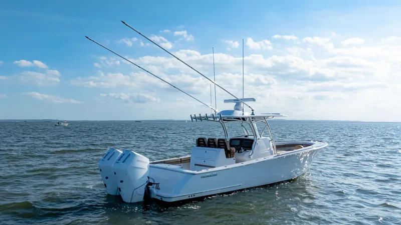 Slide: The Image of 2025 Valhalla Boatworks V-33 on open water under clear blue sky. - 8