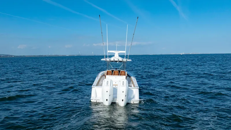 Slide: The Image of 2025 Valhalla Boatworks V-33 on open water, rear view with dual engines. - 9