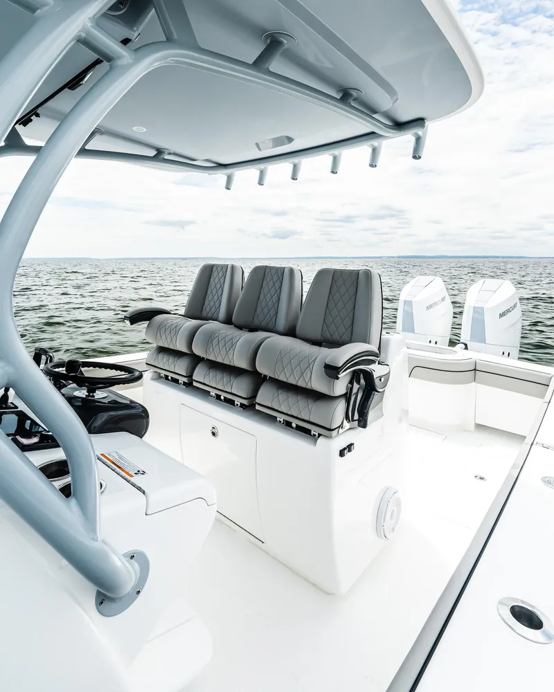 Slide: The Image of 2025 Valhalla Boatworks V-33 with sleek seating and dual engines on open water. - 11