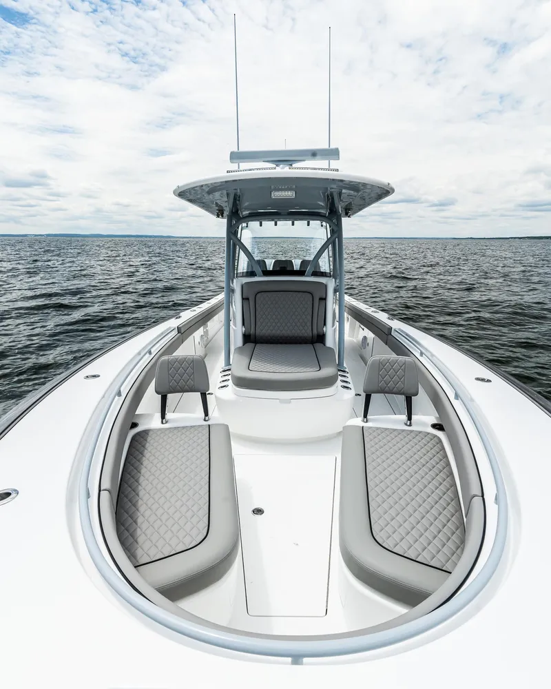 Slide: The Image of 2025 Valhalla Boatworks V-33 on open water, showcasing sleek design and spacious seating. - 18